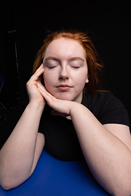 Megan sitting with eyes closed