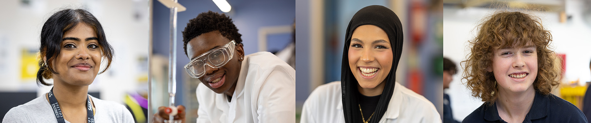 Four Uxbridge College students smiling. A girl with long hair pulled back and a nose piercing, a boy wearing a lab coat and protective glasses, a girl in a lab coat, a boy with long curly hair.