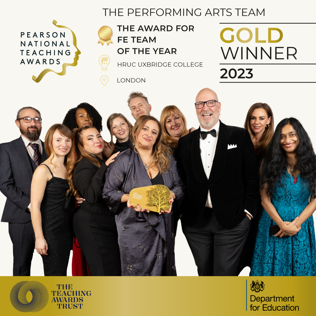 Group shot of the Performing Arts Team holding up the Teaching Team of the Year award.