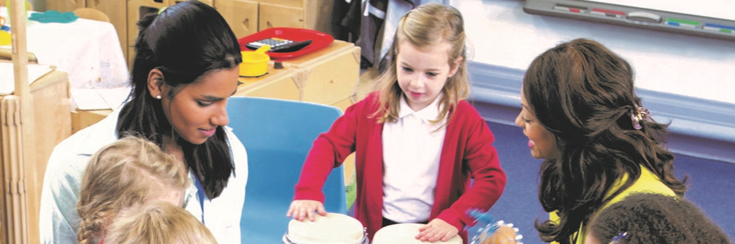 Students working with children in a group