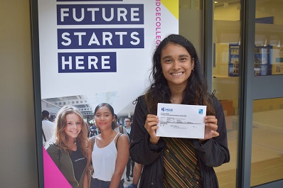 Student holding GCSE results