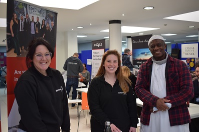 ol Hernandez (left) and Emily Kenward from Actavo with a visiting jobseeker at Jobs Fair Spring 2022
