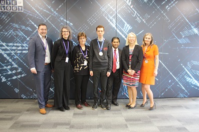 Formal group of Uxbridge College staff with Tyler Lewis in the centre