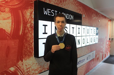 Tyler Lewis displaying medal