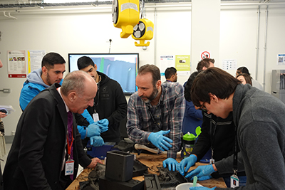 Deputy Mayor Jules Pipe CBE with staff and students from Uxbridge College immersing himself in interactive activities.