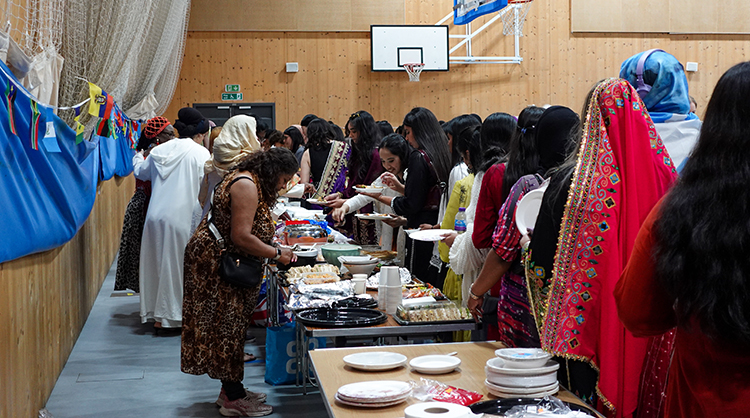 Students lining up for food at the Uxbridge Cultural day.