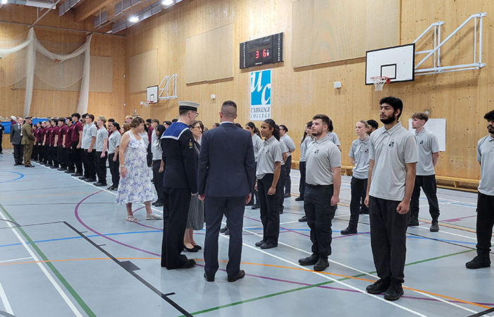 Uxbridge College Uniformed Services students at their Graduation Parade being inspected. They are in the sports hall all lined up. 