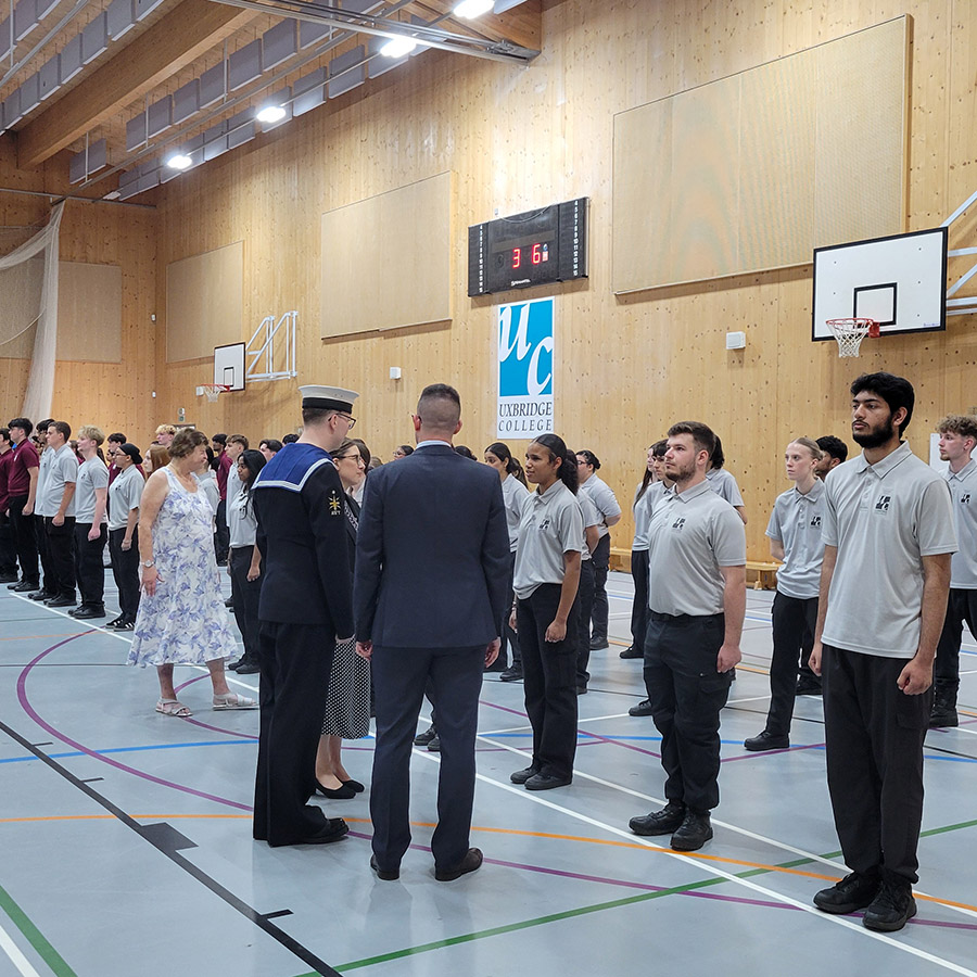 Uxbridge College Uniformed Services students at their Graduation Parade being inspected. They are in the sports hall all lined up. 