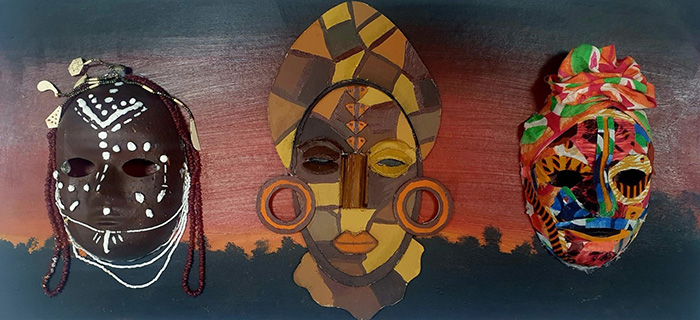 Beverley Acquah exploring her past and present of her African heritage in her triptych of masks. From left - a brown and white mask with red and white beading; a yellow, orange and brown mask depicting a headress and large hoop earrings; a multi-colour mask with a headwrap.